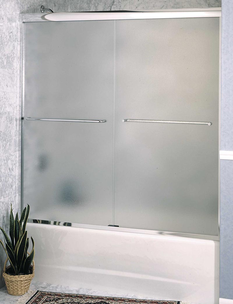 Frameless tub enclosure with acid-etched glass and silver towel handles.