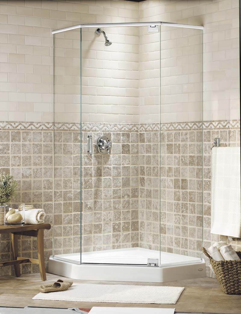 Neo-angle frameless glass shower enclosure with silver-colored hardware visible through the transparent glass.