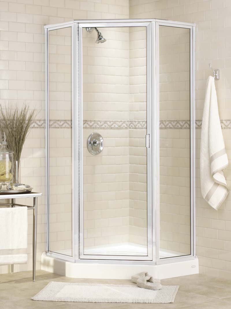 Neo-angle fully framed glass shower enclosure with silver-colored frame, hinged door, and matching shower head and hardware.