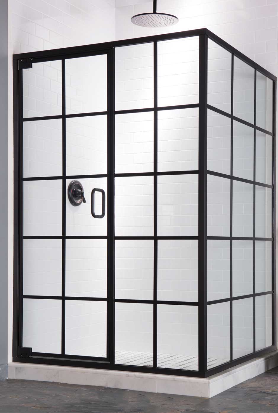 Fully-framed shower enclosure with Tudor-style square lattice pattern. Black pull handle and matching shower hardware.